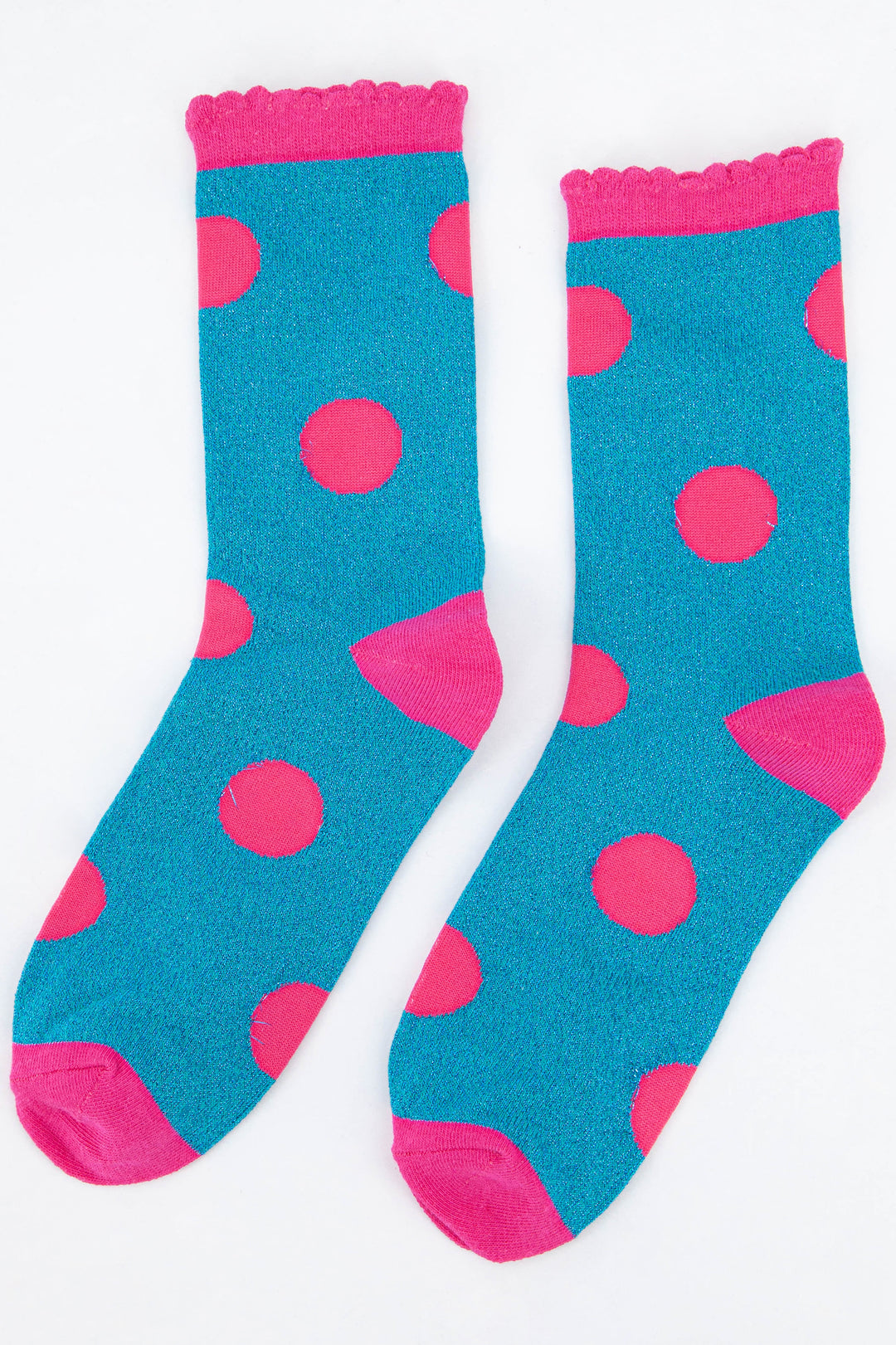 turquoise and pink glitter socks with a large spot print pattern