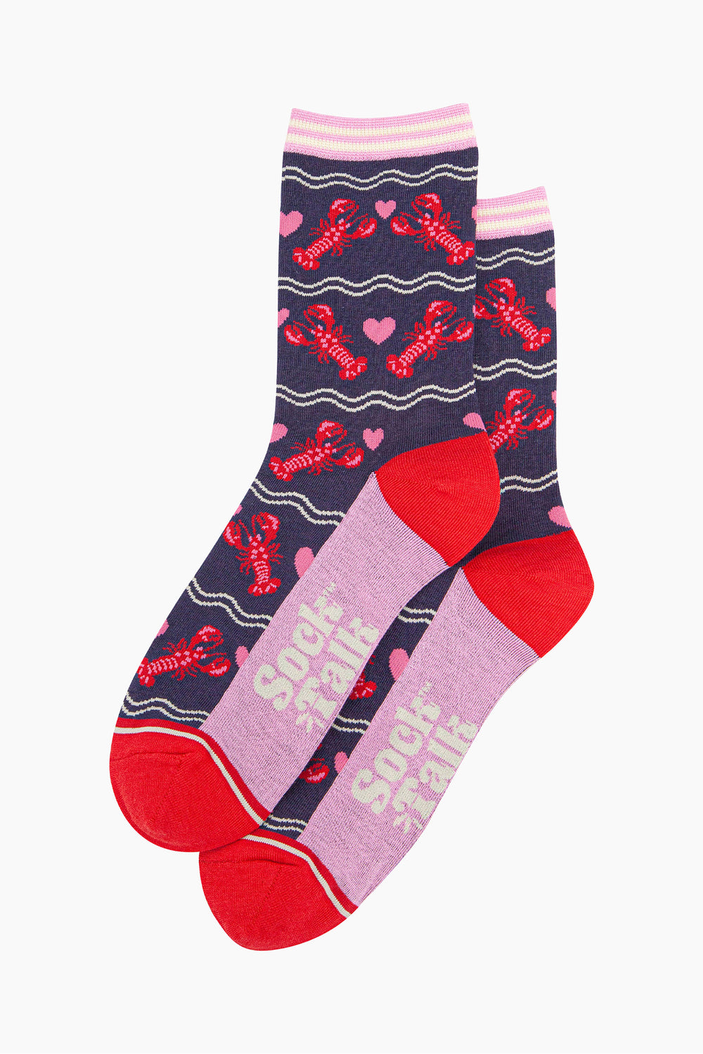 the pair of lobster and love heart socks laying flat, one on top of the other. showing clearly the all over pattern of red lobsters, white wavy lines and pink love hearts.