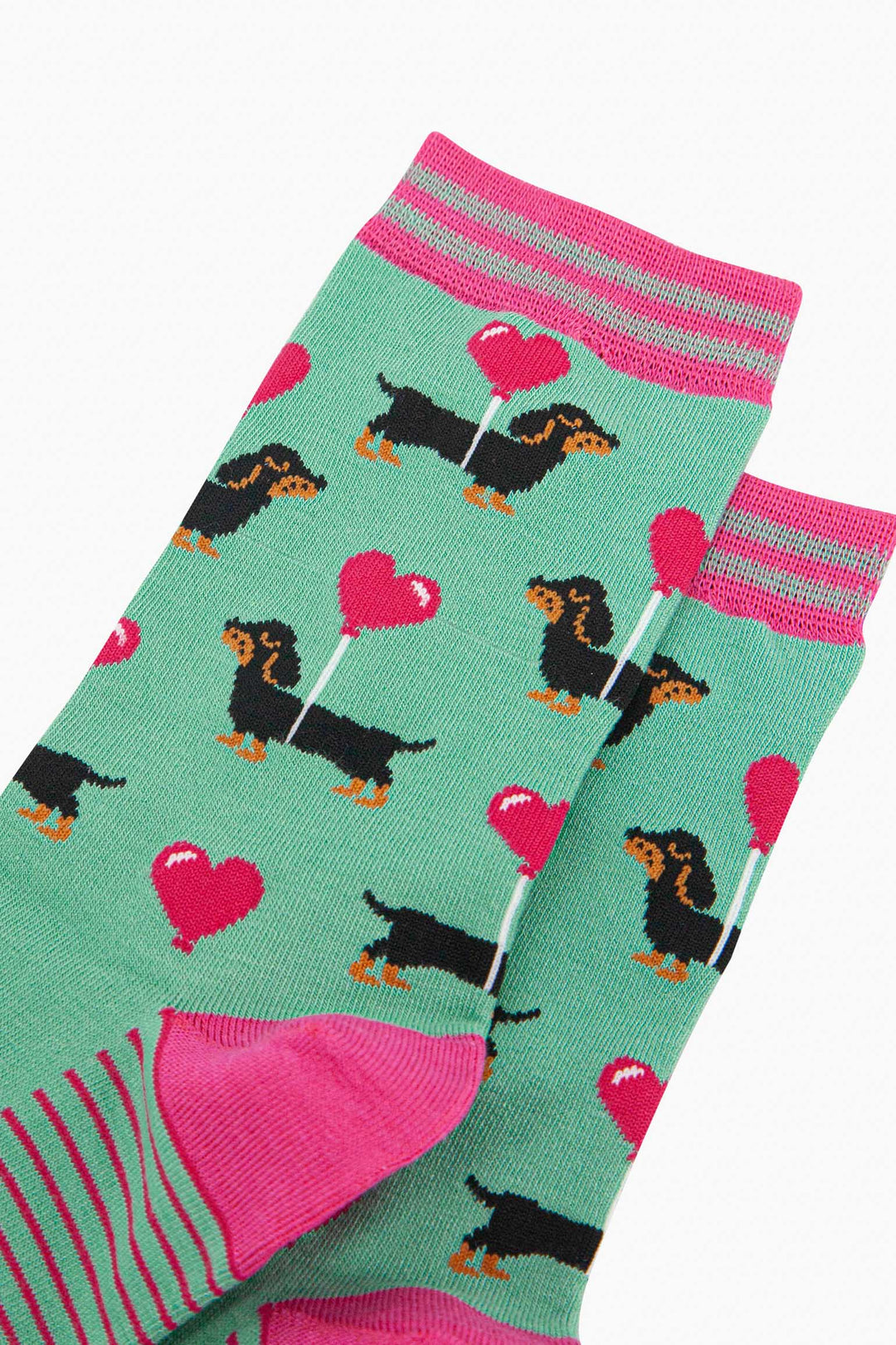 womens-bamboo-socks-mint-sausage-dog-love-heart-balloon-close-up-black-dachshuns-carrying-pink-heart-balloon