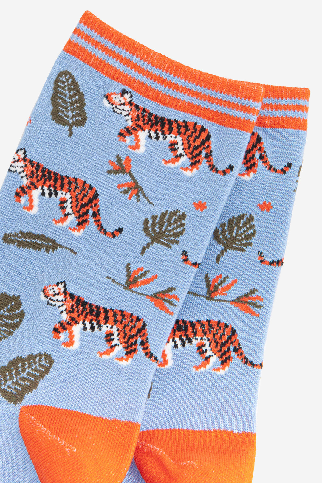 close up of the tiger big cat pattern on the light blue bamboo ankle socks