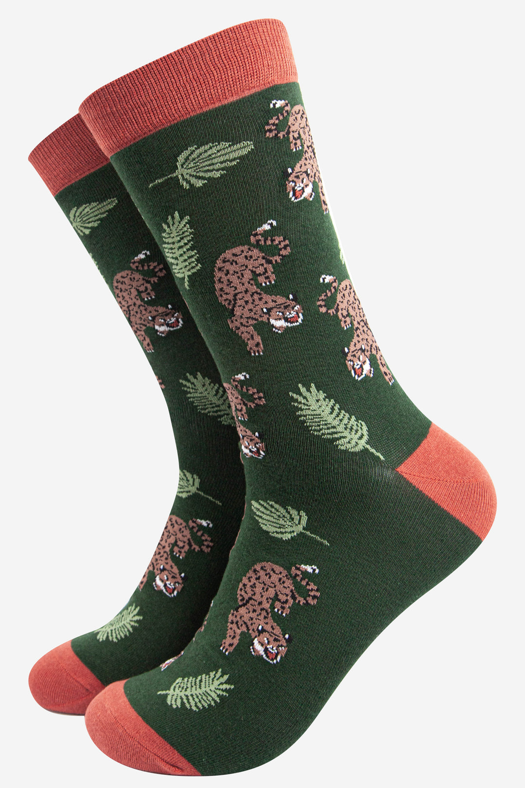 green and orange bamboo socks with an all over pattern featuring a prowling cheetah and jungle leaves