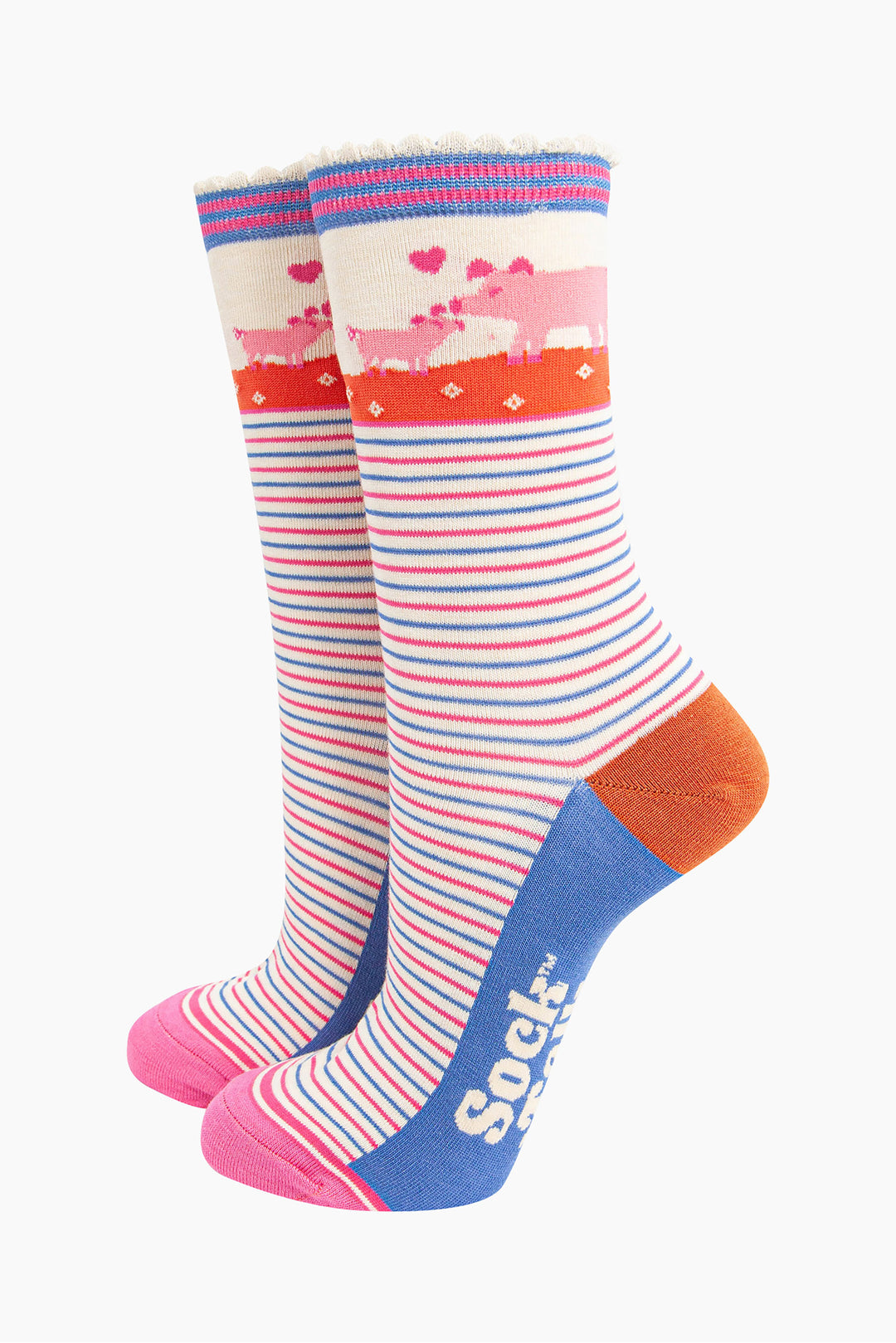 cream socks with pink and blue alternating horizontal pin stripes. the ankle features a mother pig and piglet in pink surrounded by pink love hearts