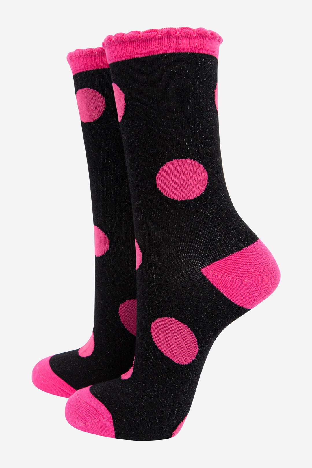 black and pink glitter ankle socks with an all over large polka dot spot pattern and sparkly shimmer, the socks have scalloped edge cuffs