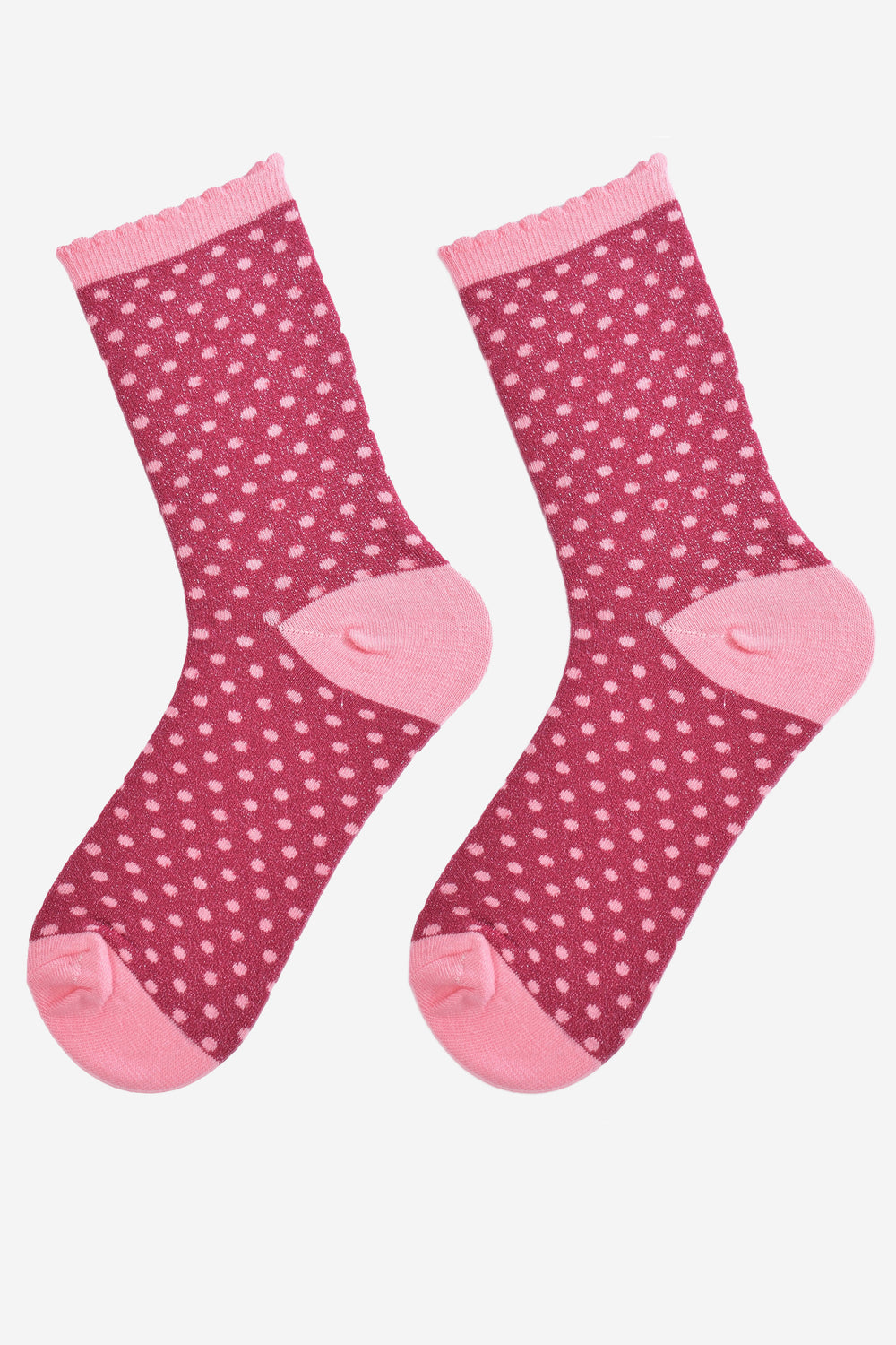 showing the sparkly glitter socks laying flat, the small pink polka dot pattern is all over the sock as is the glitter sparkle