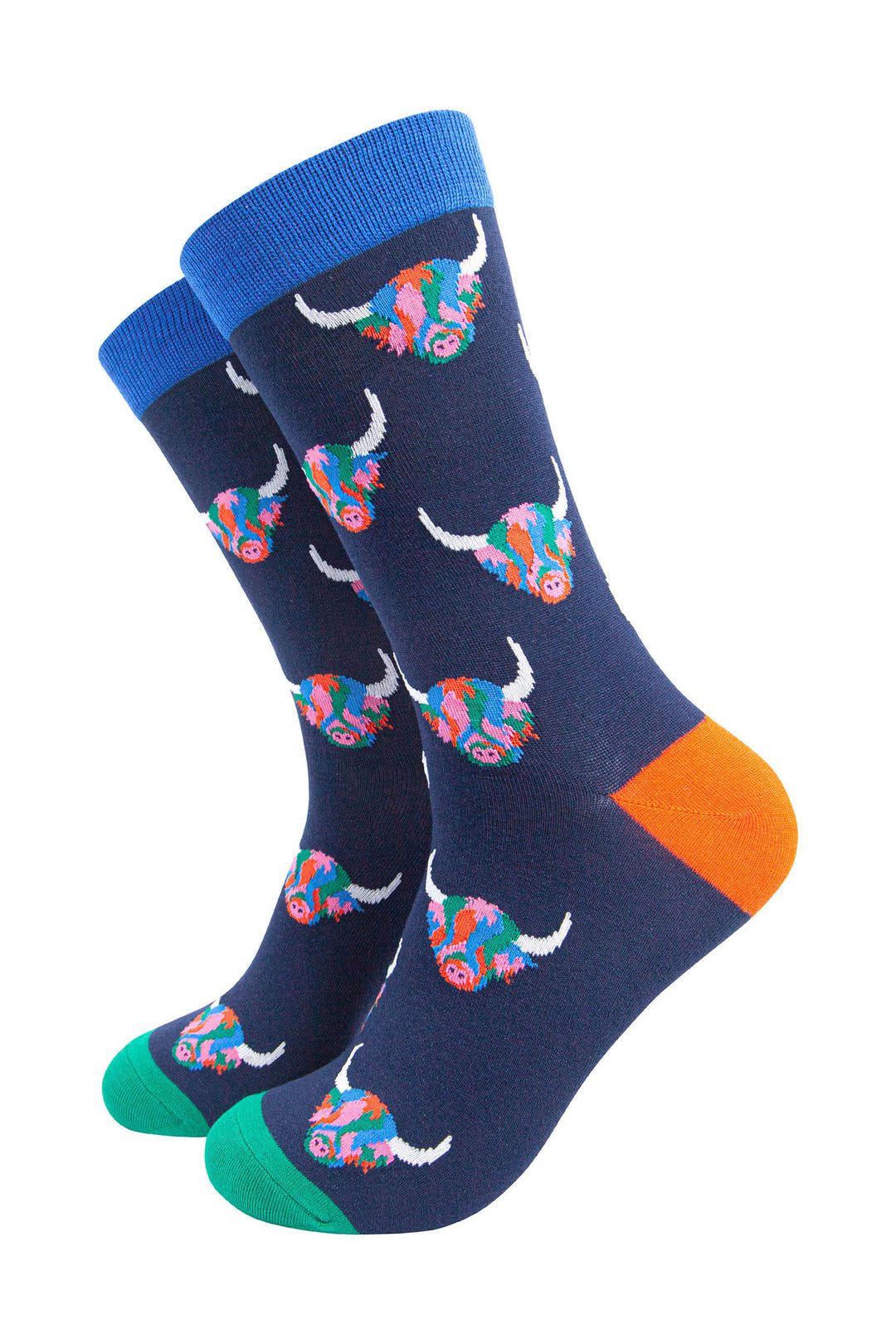 navy blue dress socks with an all over pattern of multicoloured highland cows