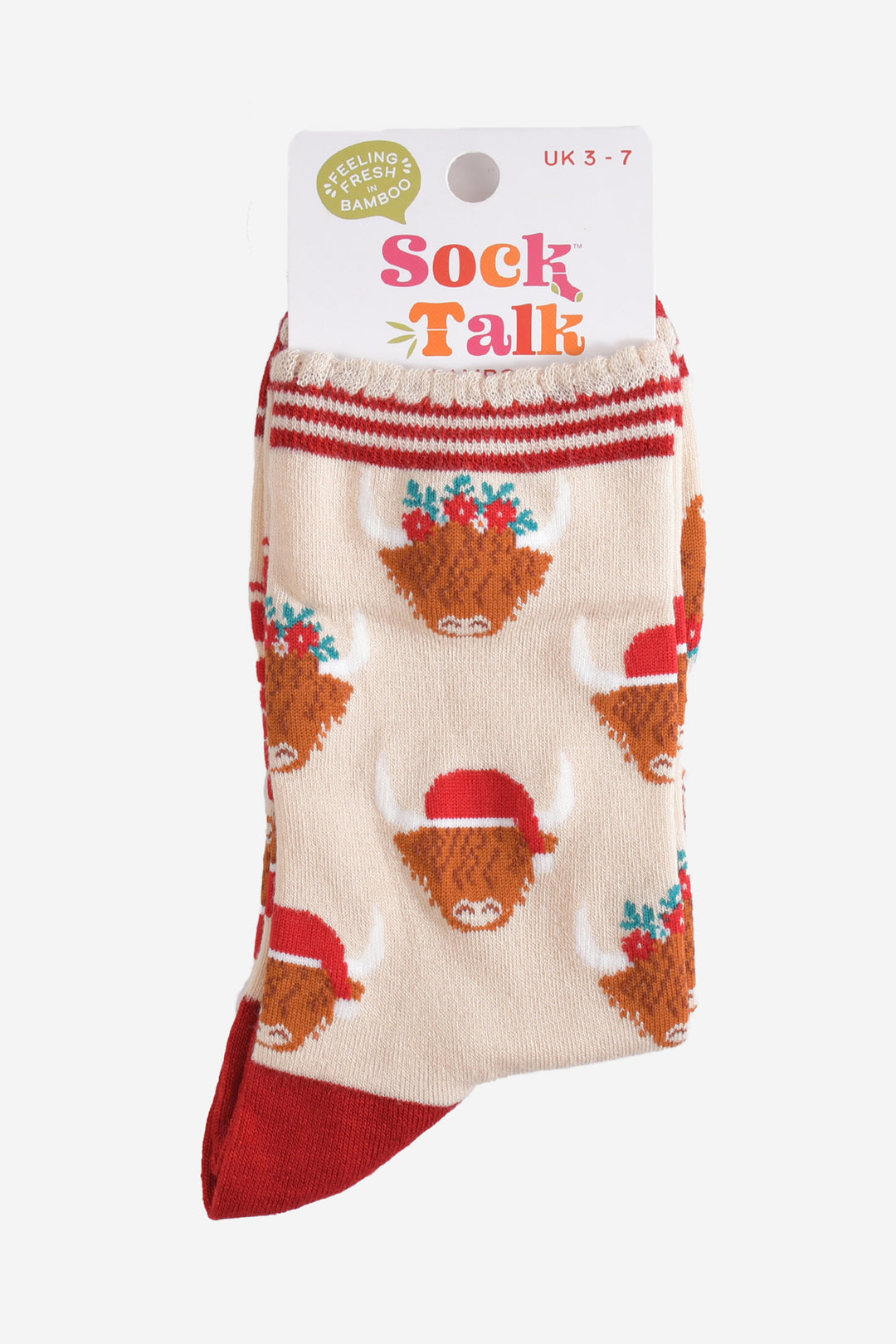 festive highland cow bamboo socks in their sock talk packaging, these socks are a uk size 3-7