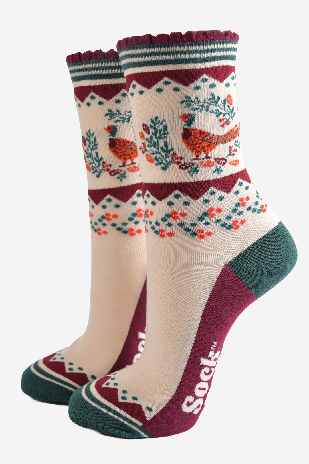 cream, green and burgundy socks with a woodland pheasant and autumn foliage wreath on the ankle