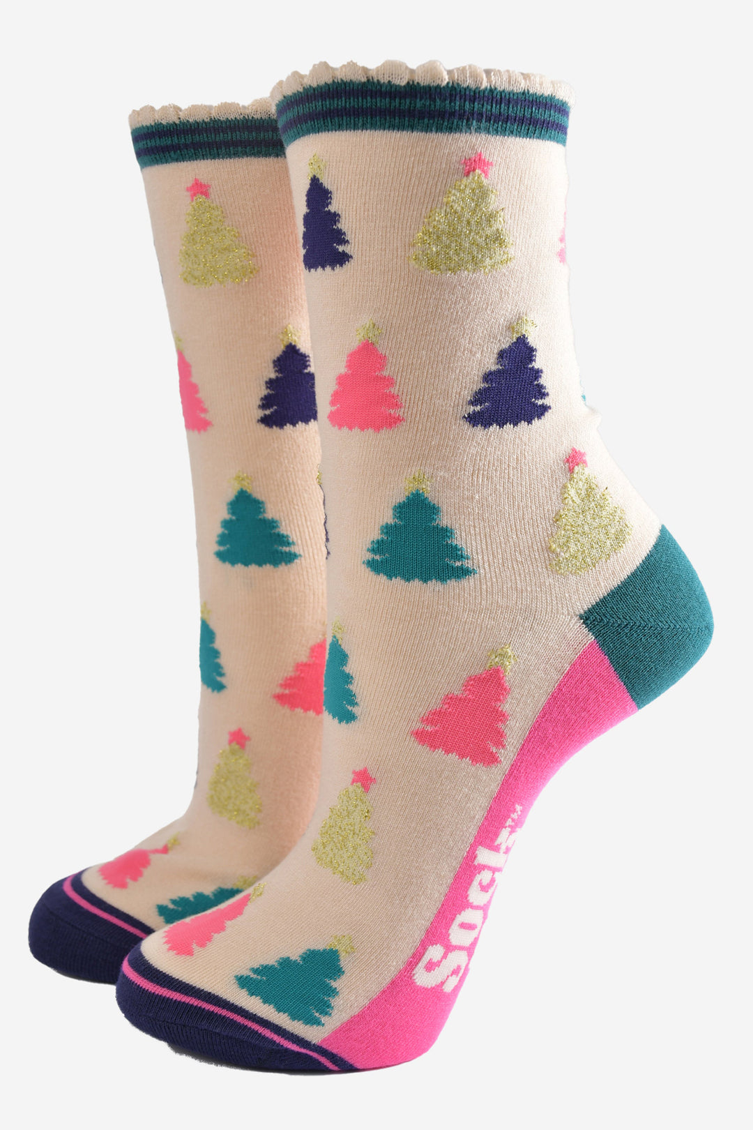 cream bamboo socks with a multicoloured christmas tree pattern all over, the trees are pink, gold, green and navy blue