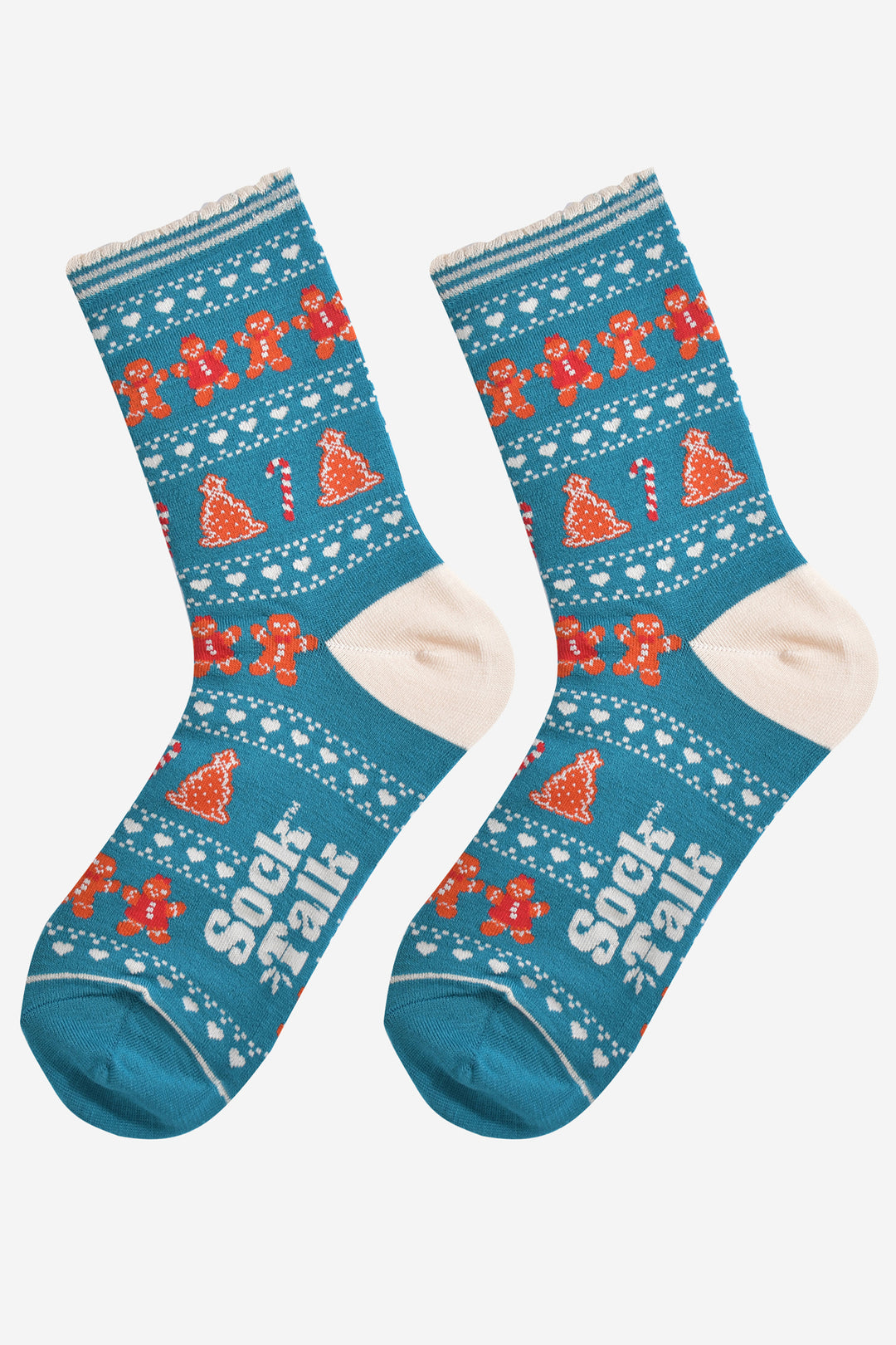 showing the festive gingerbread socks laying flat, the fair isle pattern is all over the socks and features gingerbread men, gingerbread women, gingerbread xmas tree cookies, candy canes and love hearts