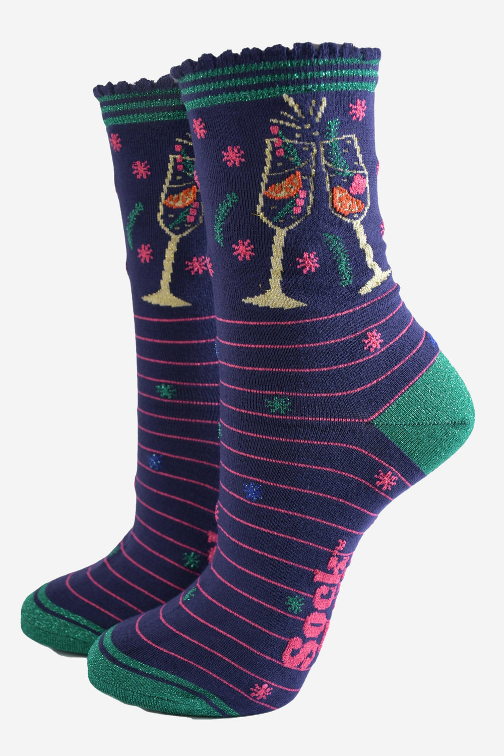 navy blue socks with pink stripes and green heel, toe and striped cuff, on the ankle is a multicoloured design showing two clinking cocktail flutes with a fruity sparking drink inside