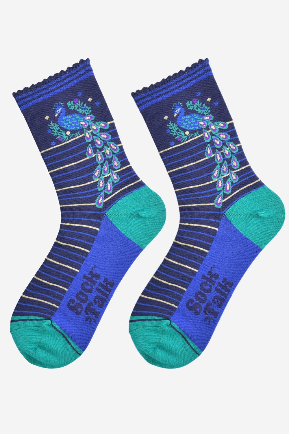 showing the striped peacock socks laying flat. the peacock tail is fanned and hangs down the length of the ankle of the sock. the sole is royal blue and the heel and toe a contrasting green