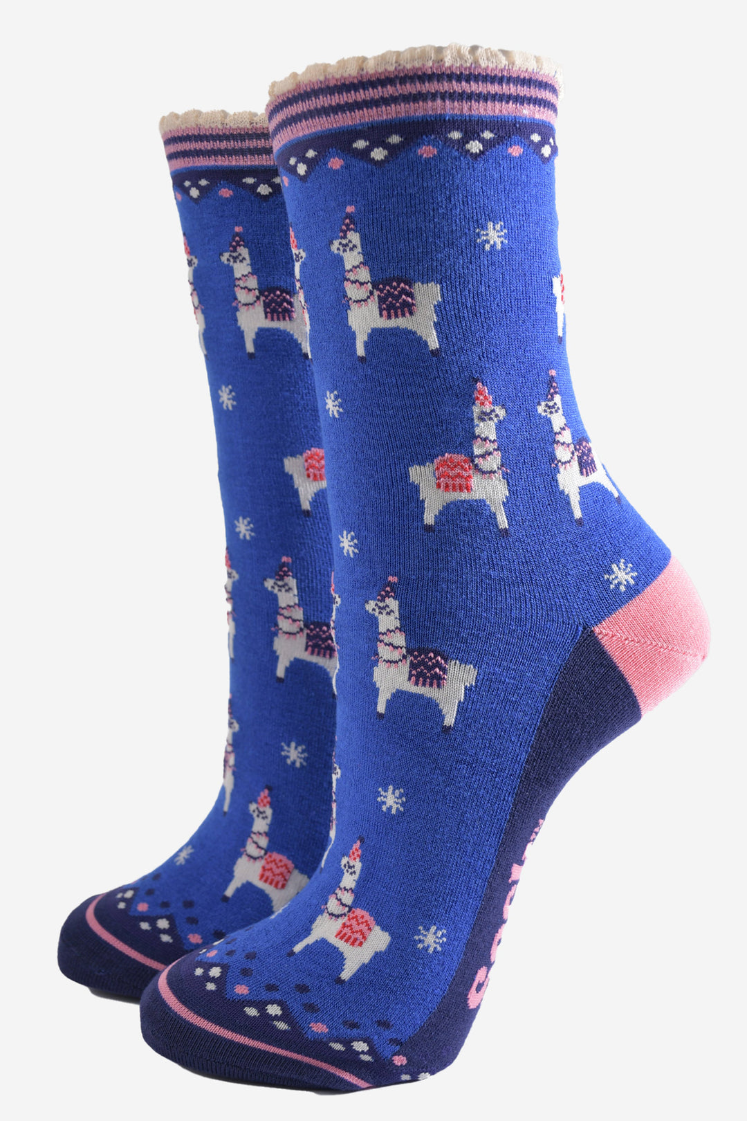 blue bamboo socks with a pink striped cuff featuring a pattern of llamas wearing party hats and party lights