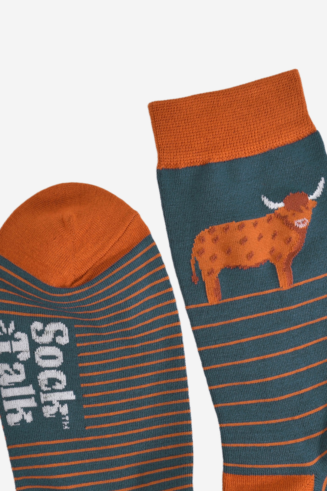 close up of the toe and the cuff of the socks, showing the prominent stripe pattern and large highland cow on the ankle