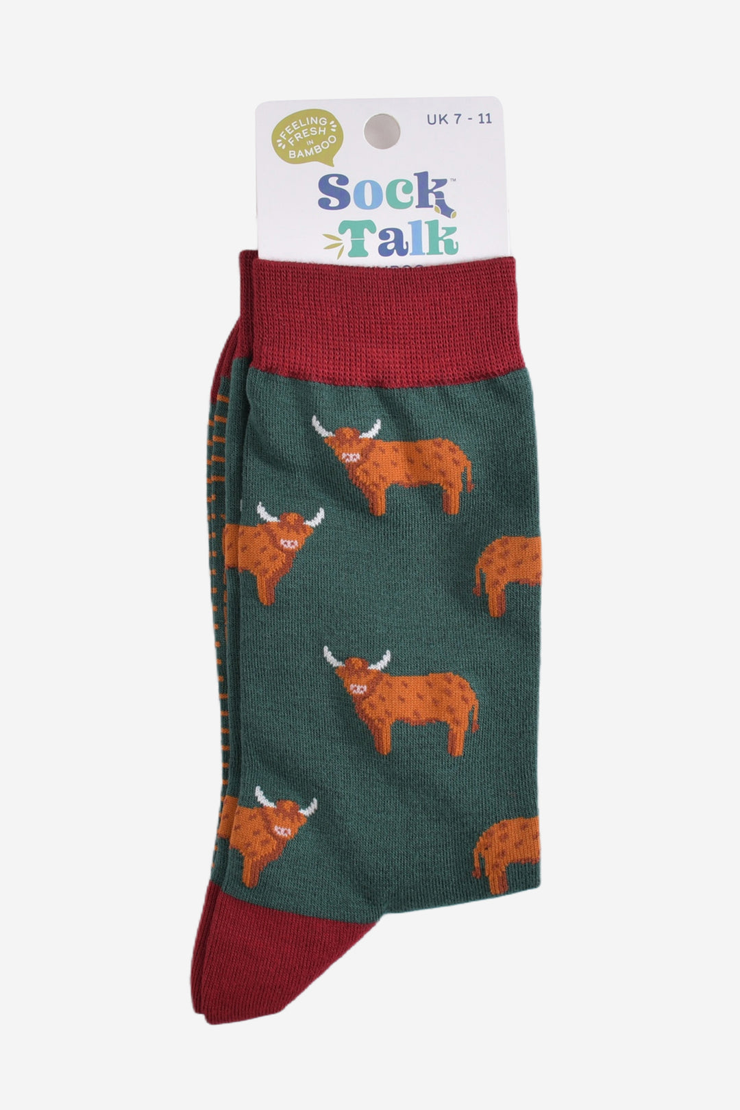 green and red highland cow bamboo socks in their sock talk packaging, these socks are uk size 7-11