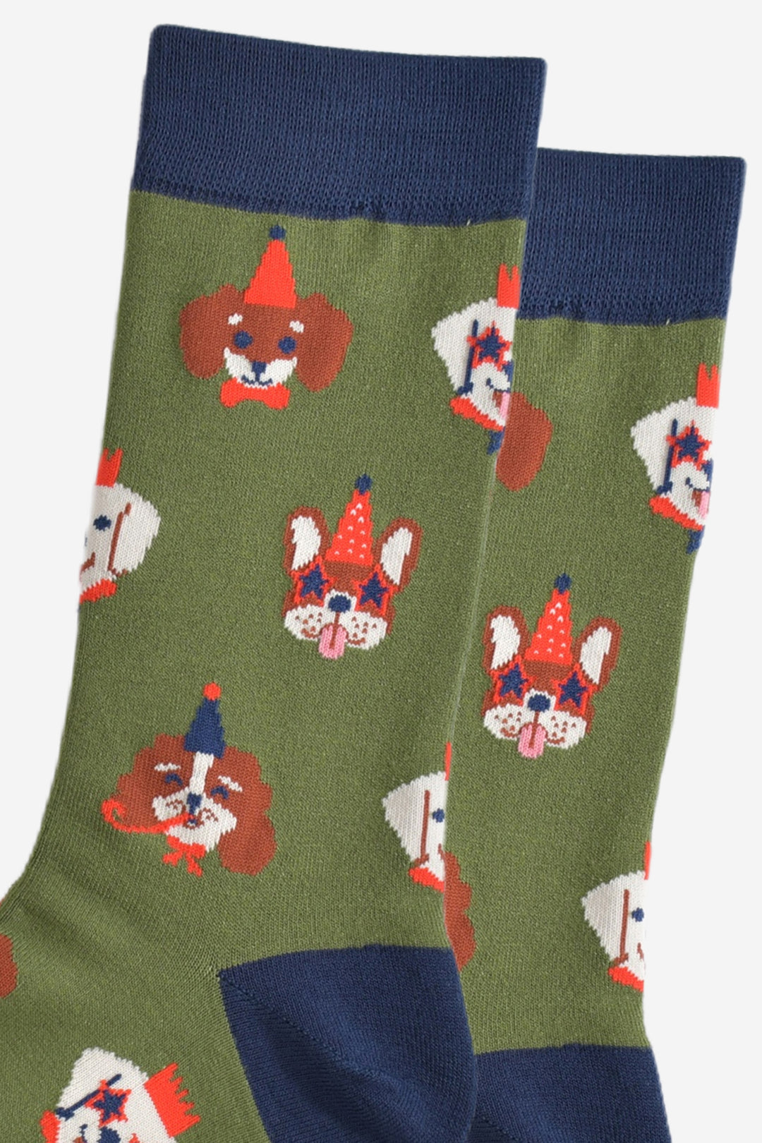 close up of the dog faces on the socks, showing in detail the party hats, glasses and accessories they are wearing