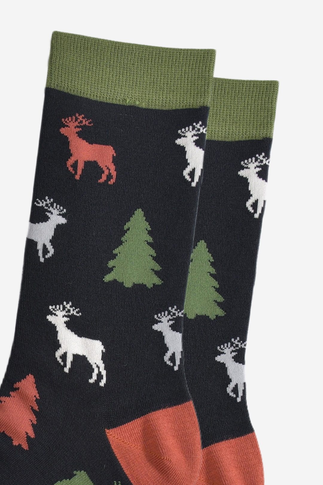 close up of the stag and xmas tree pattern, the stage are stading and profile and have clearly defined antlers