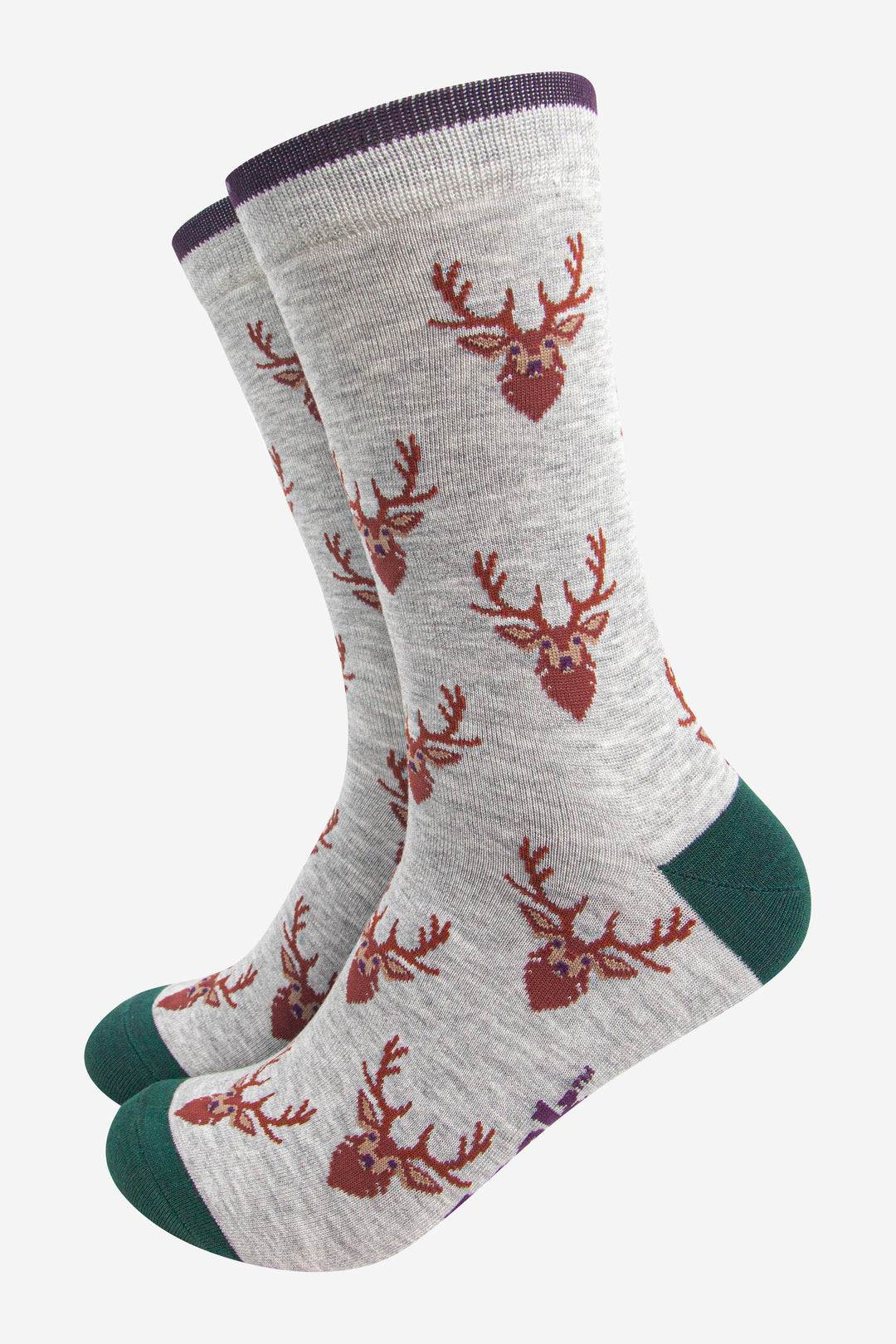 grey socks with green heel, toe and cuff with an all over pattern of brown stags heads.