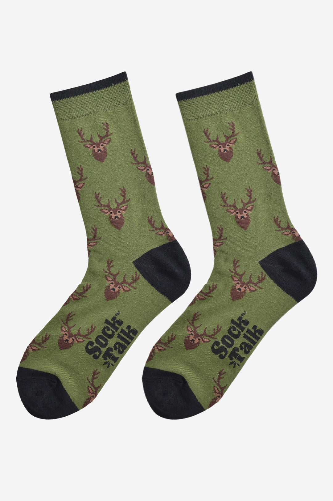 showing the green stag socks laying flat, there is an all over design of stags heads on a green background