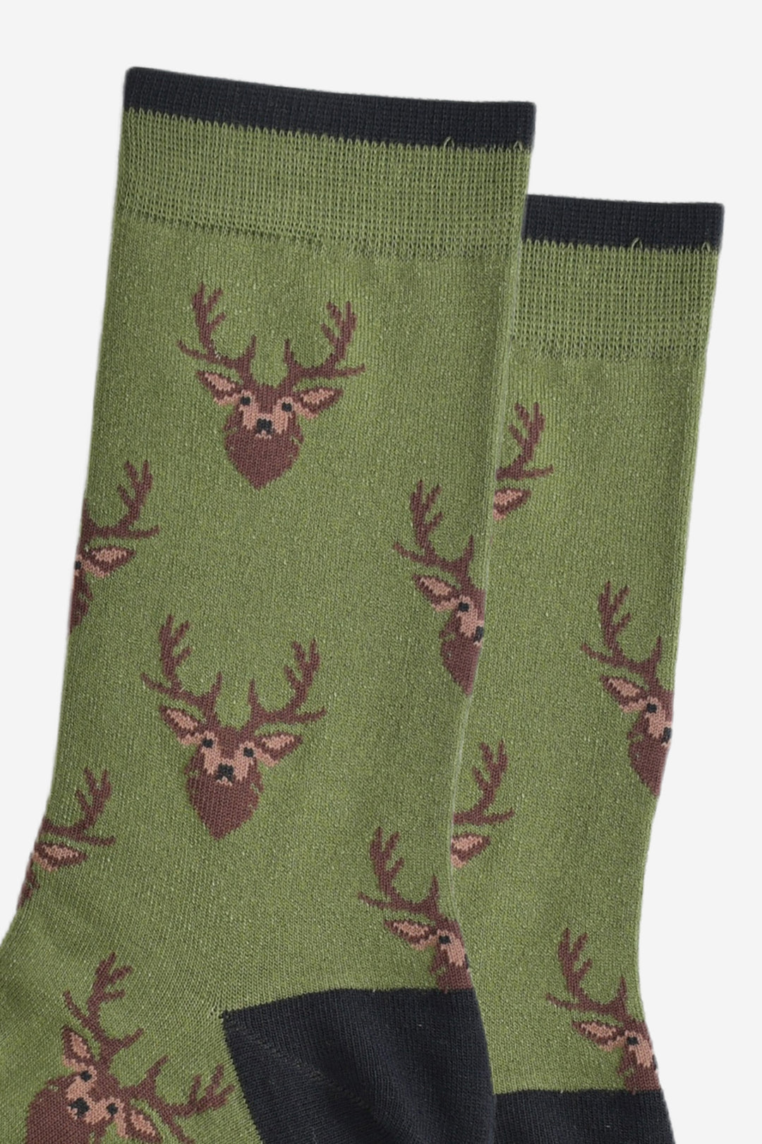 close up of the stag head design on the socks, the stags heads are brown with pointed antlers