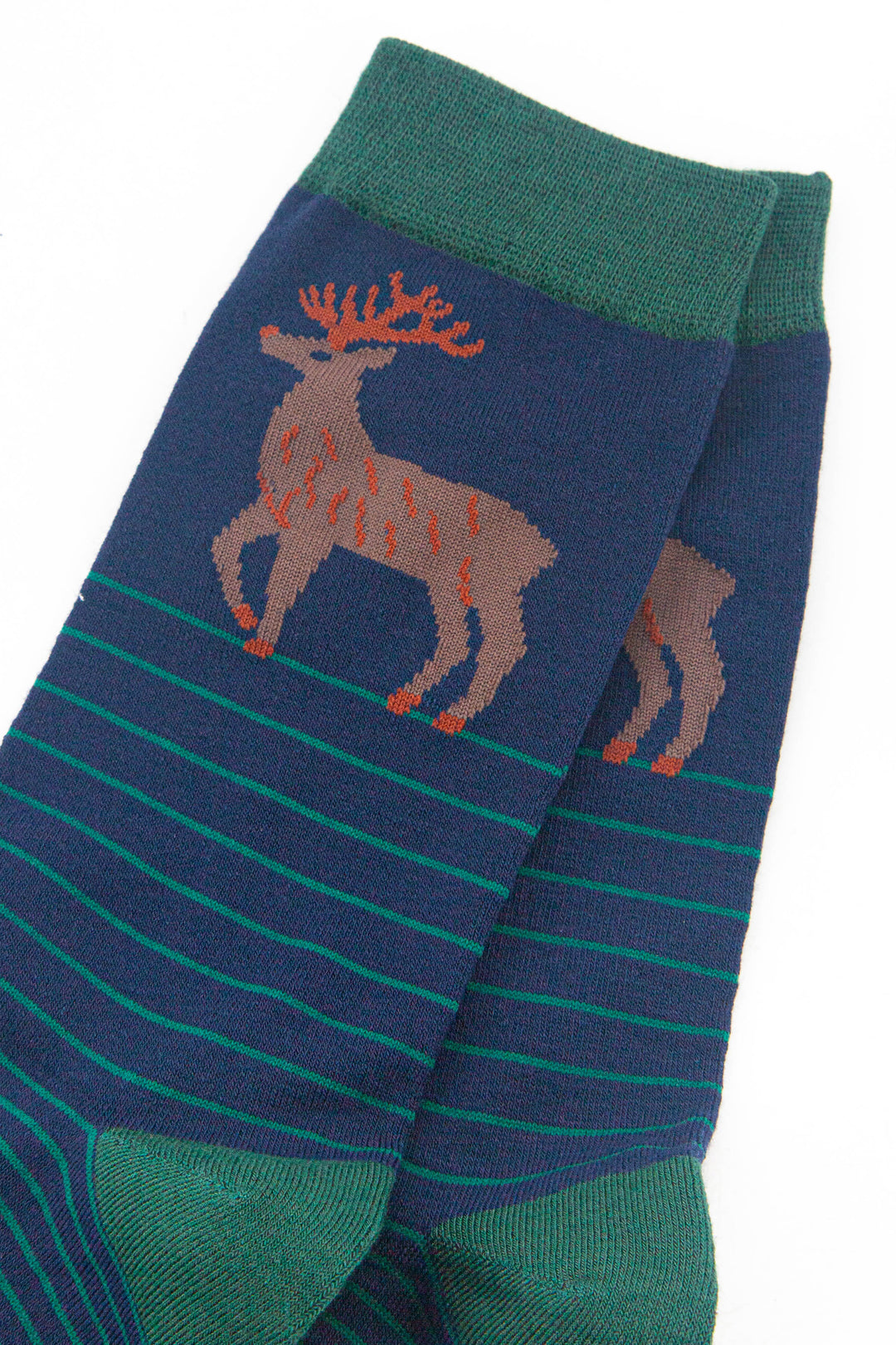 close up of the stag design on the ankle of the socks, the stag is brown with orange antlers