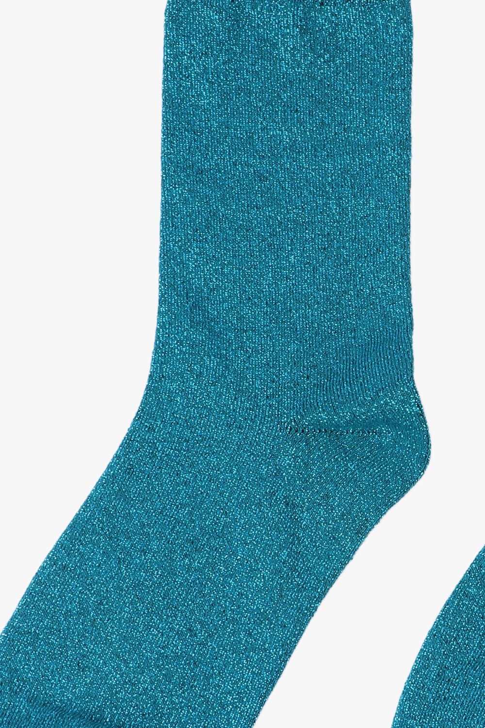 close up of the blue sparkle on these teal knee high socks