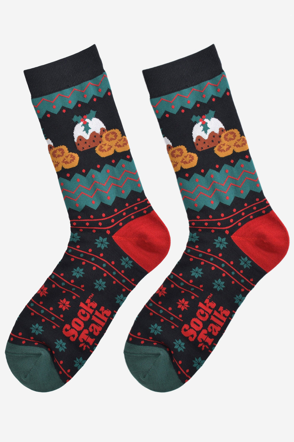 black, green and red fair isle style socks laying flat, showing the all over pattern and highlighting the christmas pudding and mince pie design on the ankle of the socks