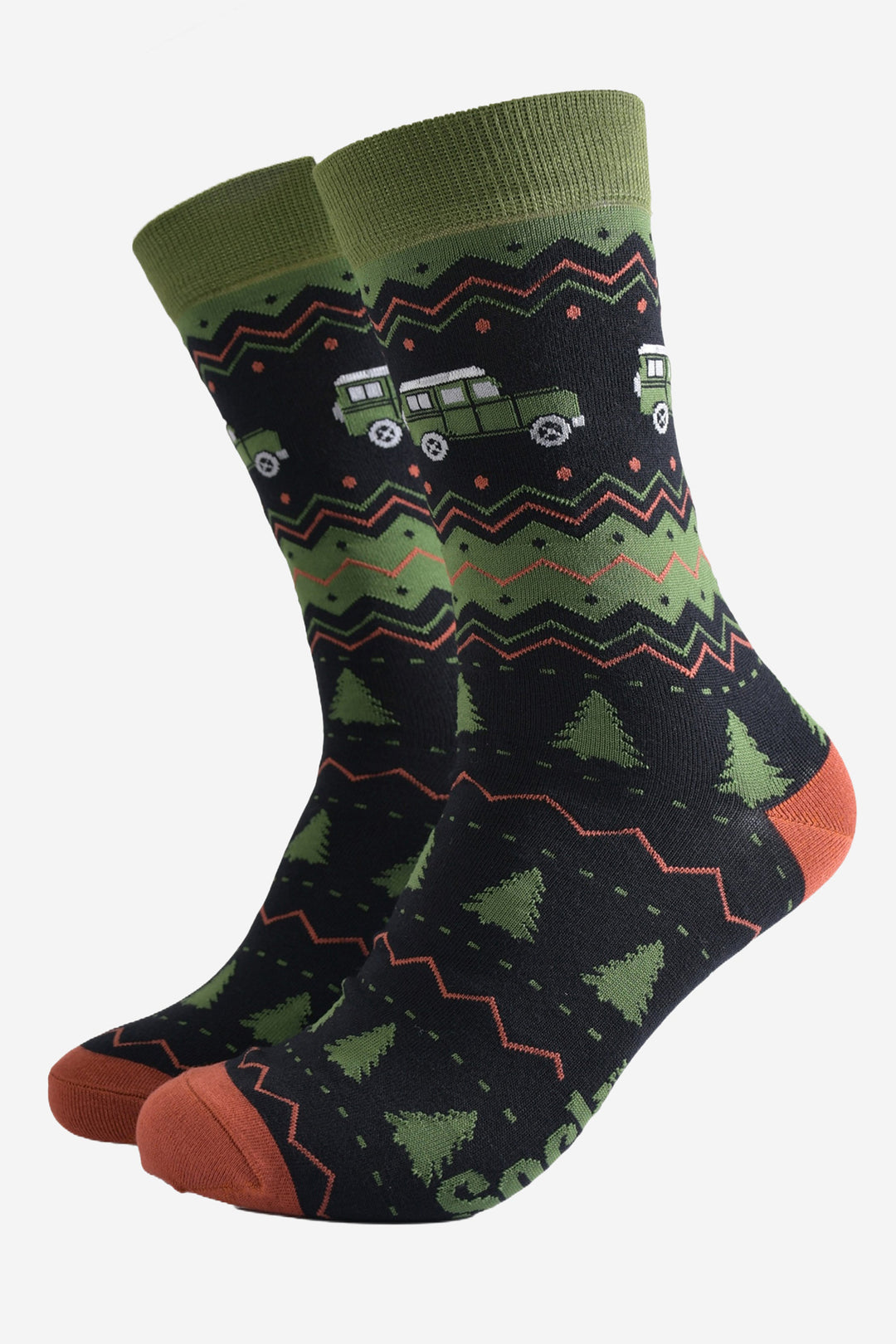 black and green dress socks with a pattern of green christmas trees and green off road vehicles, the pattern on the socks is fair isle inspired