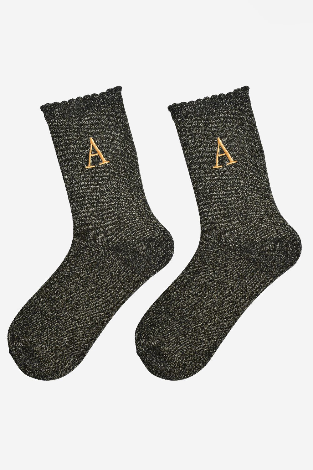 showing the glitter socks laying flat, they have a scalloped cuff and an all over gold sparkle