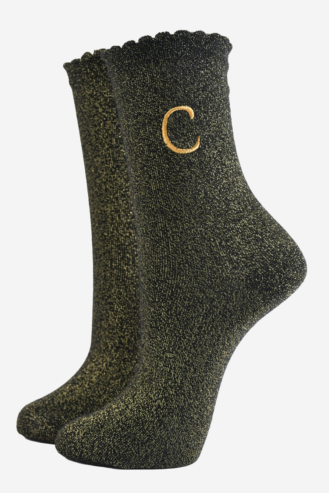 black ankle socks with a scalloped cuff, with an all over gold glitter sparkle and an embroidered gold letter c on the ankle