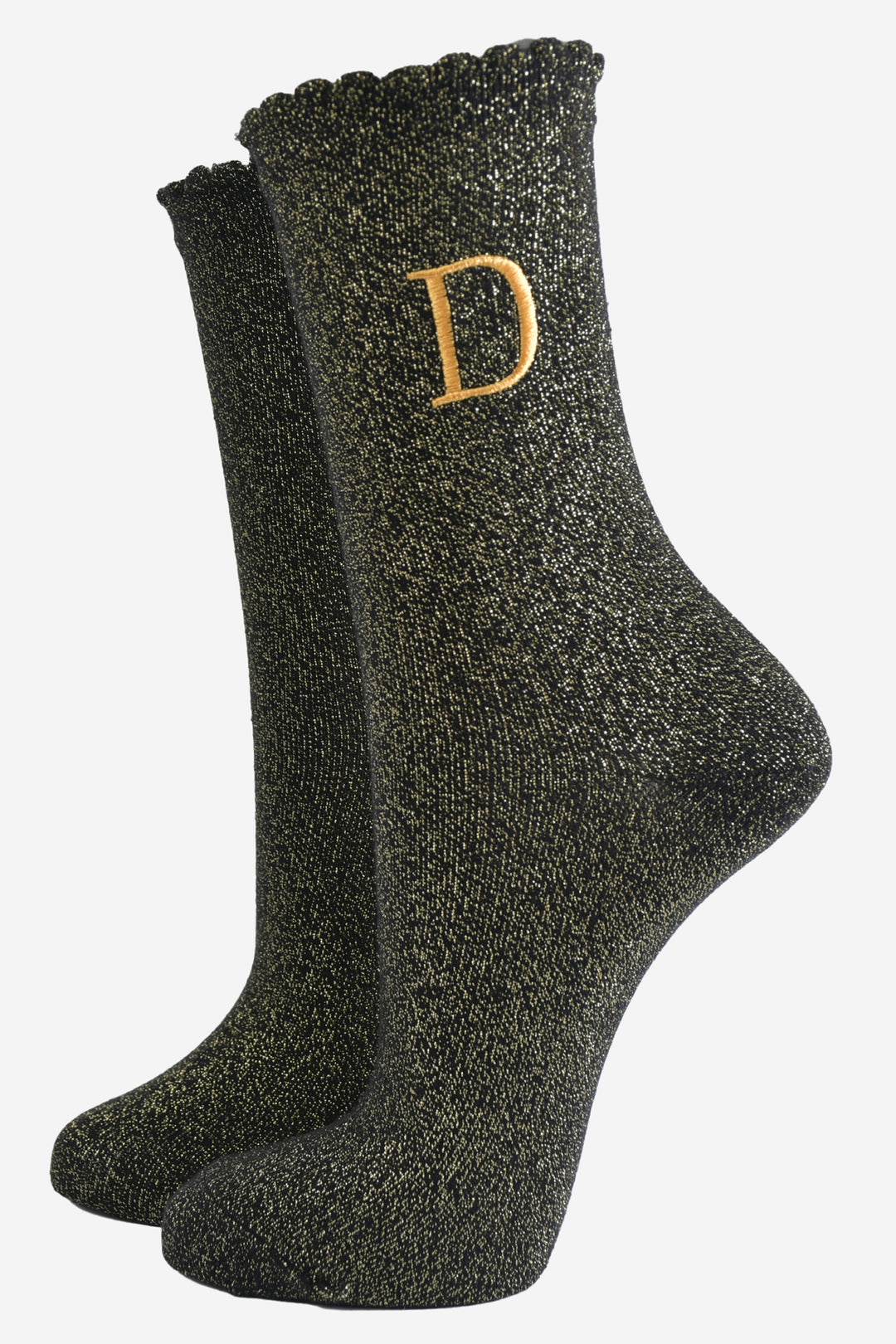 black ankle socks with a scalloped cuff, with an all over gold glitter sparkle and an embroidered gold letter d on the ankle