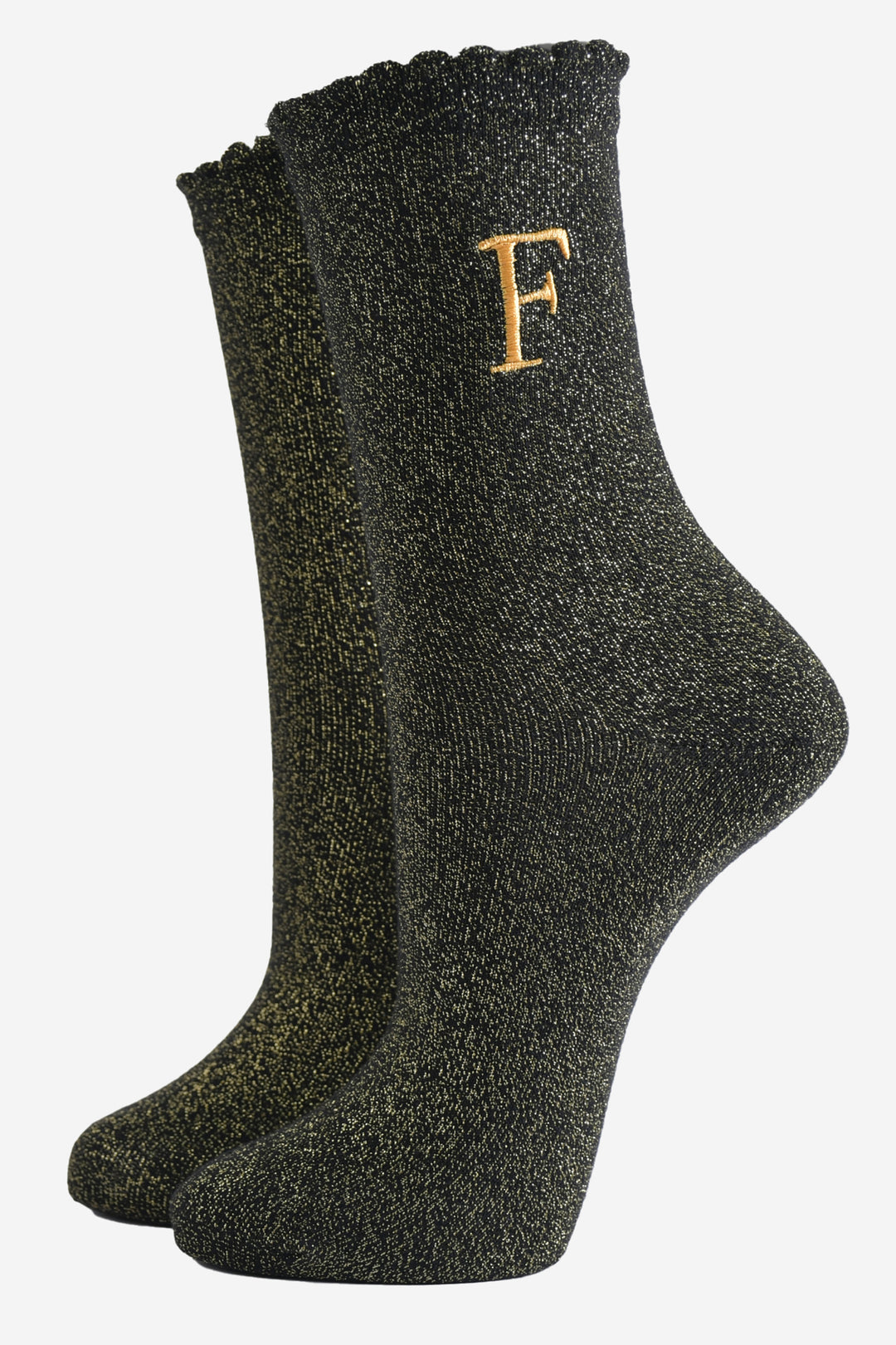 black ankle socks with a scalloped cuff, with an all over gold glitter sparkle and an embroidered gold letter f on the ankle