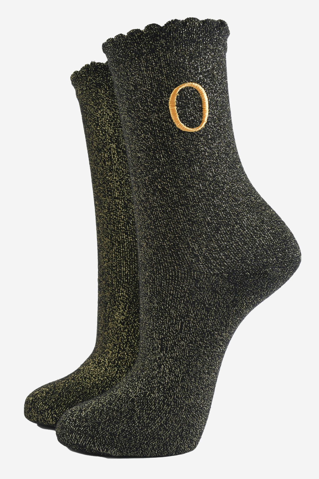 black ankle socks with a scalloped cuff, with an all over gold glitter sparkle and an embroidered gold letter o on the ankle