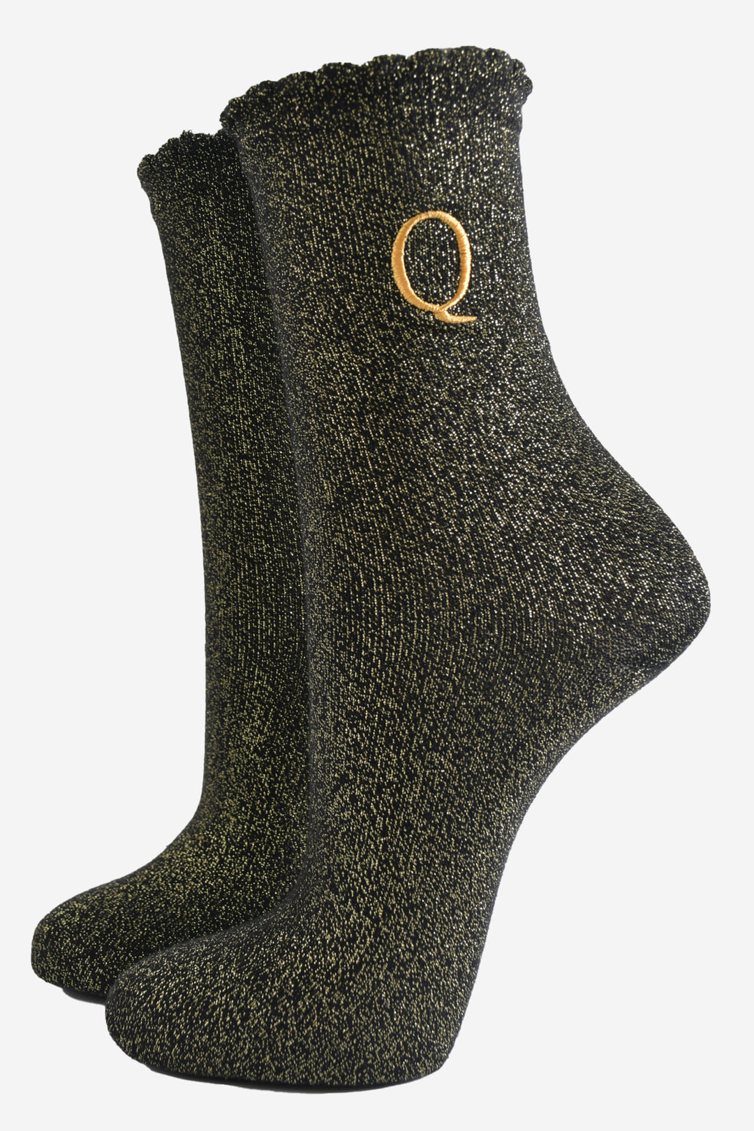 black ankle socks with a scalloped cuff, with an all over gold glitter sparkle and an embroidered gold letter q on the ankle