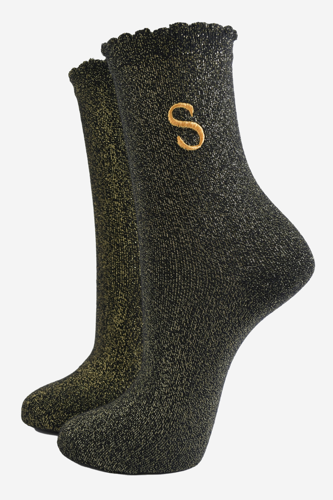 black ankle socks with a scalloped cuff, with an all over gold glitter sparkle and an embroidered gold letter s on the ankle