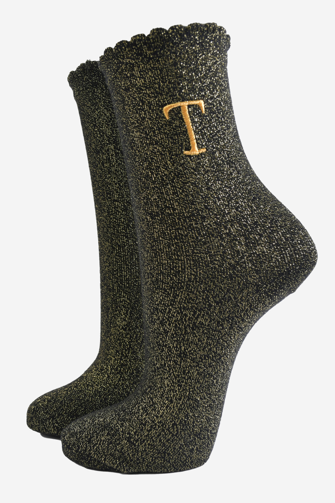 black ankle socks with a scalloped cuff, with an all over gold glitter sparkle and an embroidered gold letter t on the ankle