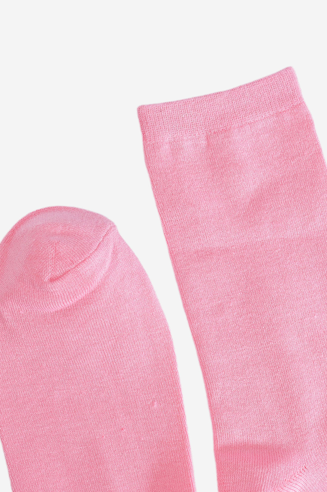 close up of the cuff and toe, both are plain pink the same as the base of the socks. the cuff is straight cut.