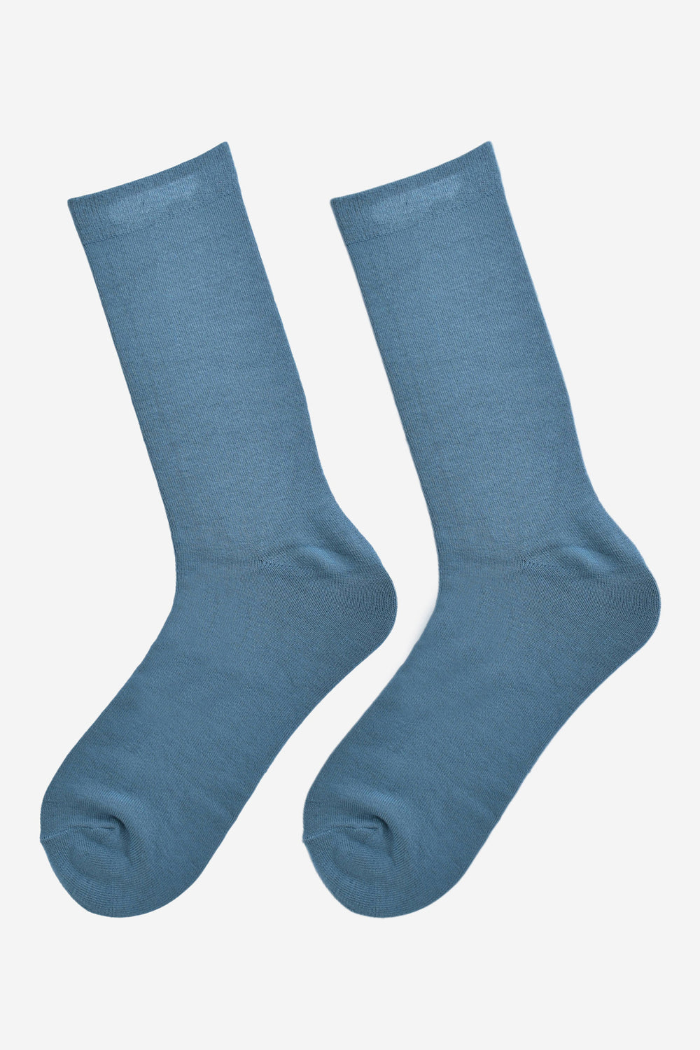 teal blue bamboo socks laying flat, showing the all over consistent colour