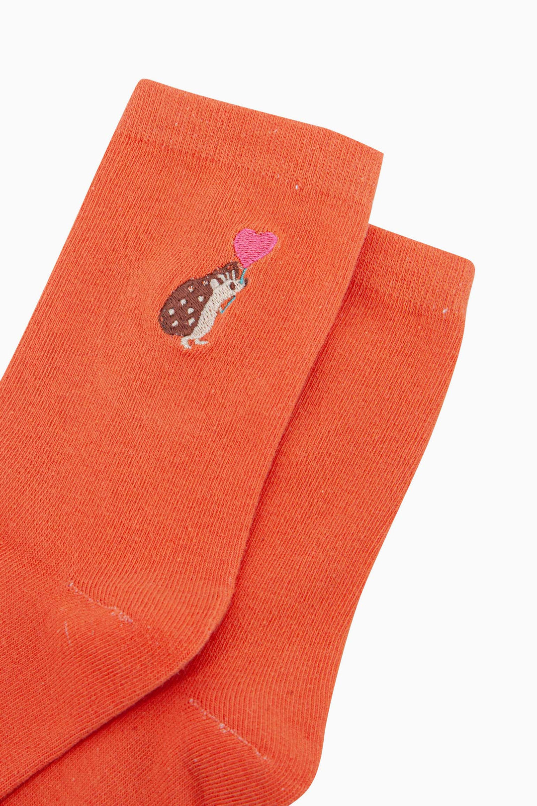 womens-embroidered-socks-orange-hedgehog-heart-balloon-close-up-brown-woodland-hedgehog-carrying-pink-love-heart-shaped-balloon