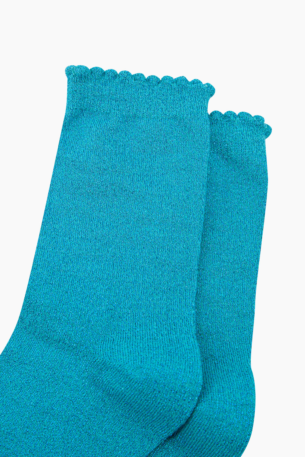 close up of the turquoise sparkly socks and frilly scalloped cuff