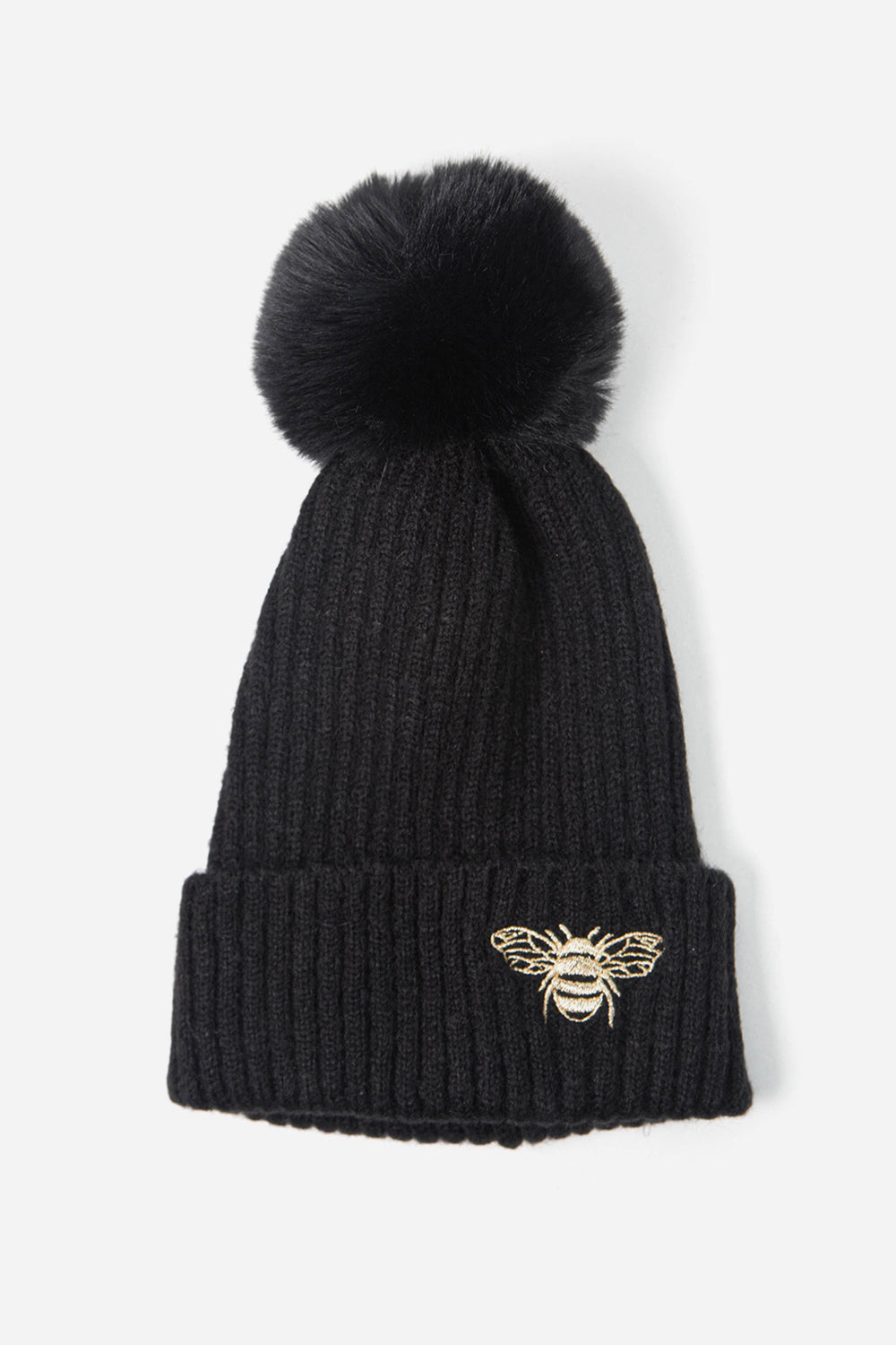 black ribbed beanie hat with a pom pom on top and a gold embroidered bee motif on the cuff of the hat