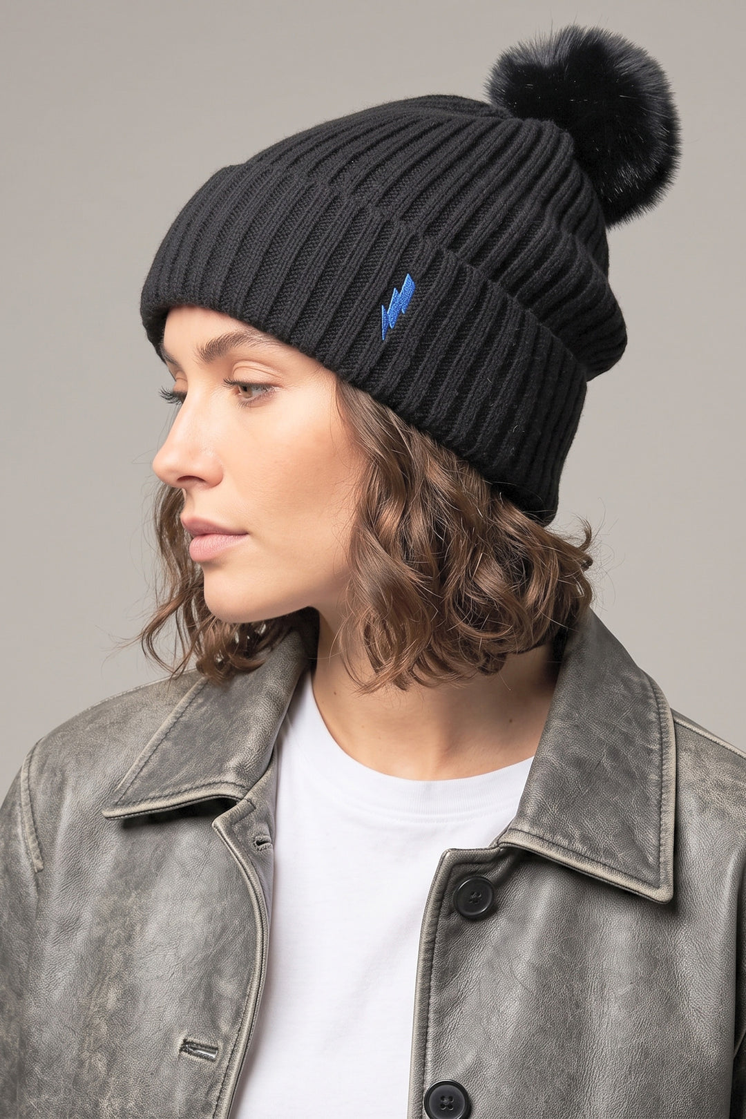 black-pom-pom-hat-blue-lightning-bolt