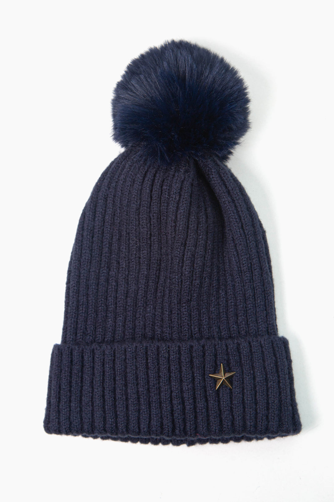 navy blue ribbed beanie hat with a pom pom on top and a gold coloured metal star motif on the cuff of the hat