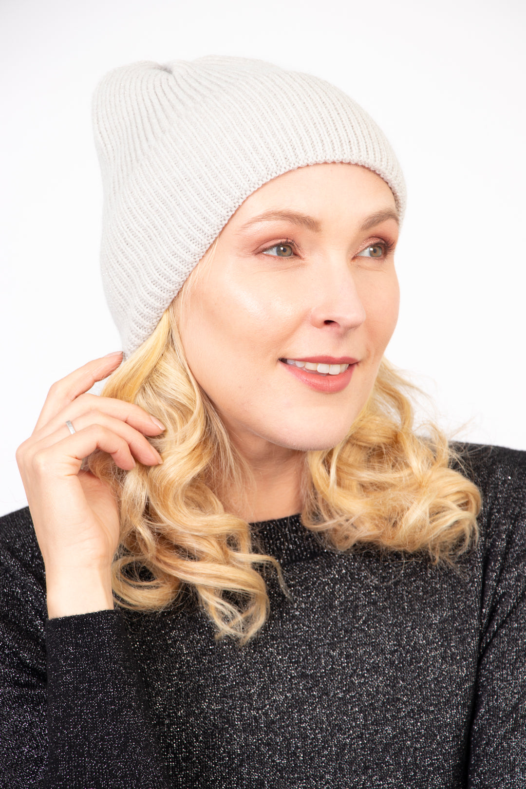 model wearing a light grey winter beanie hat