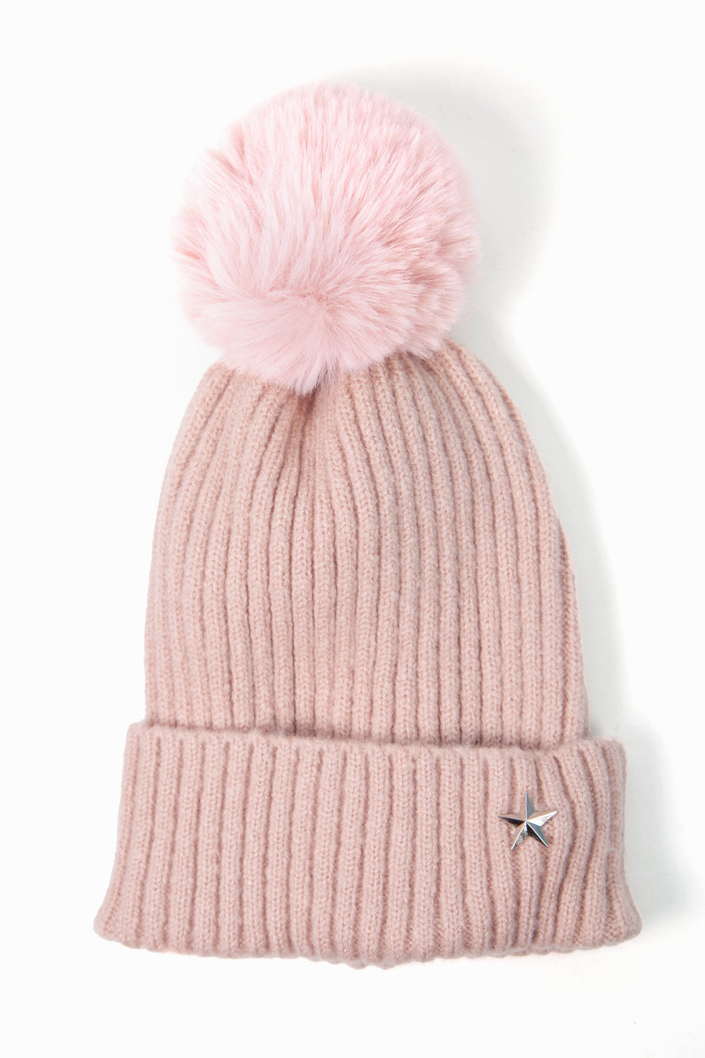 dusty pink knitted pom pom beanie hat with ribbed design and a silver metal star on the rim