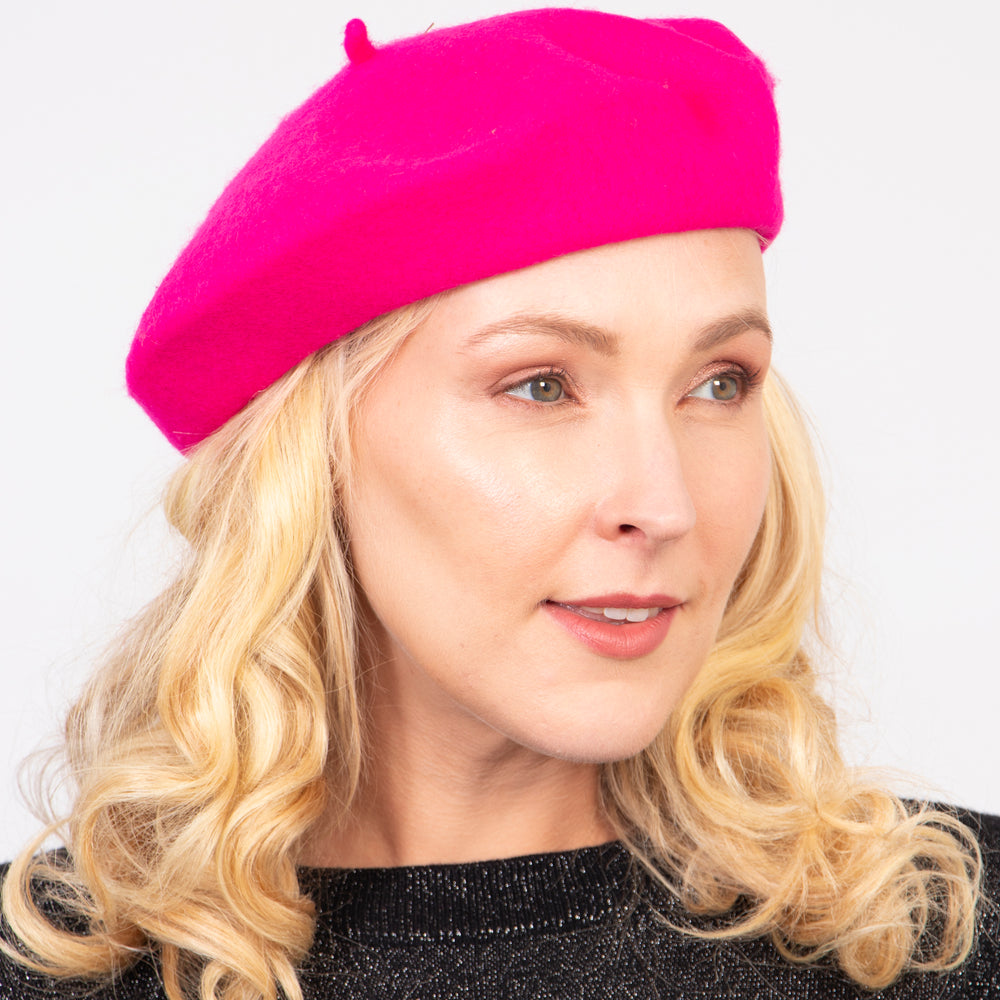 model wearing a fuchsia pink plain beret hat