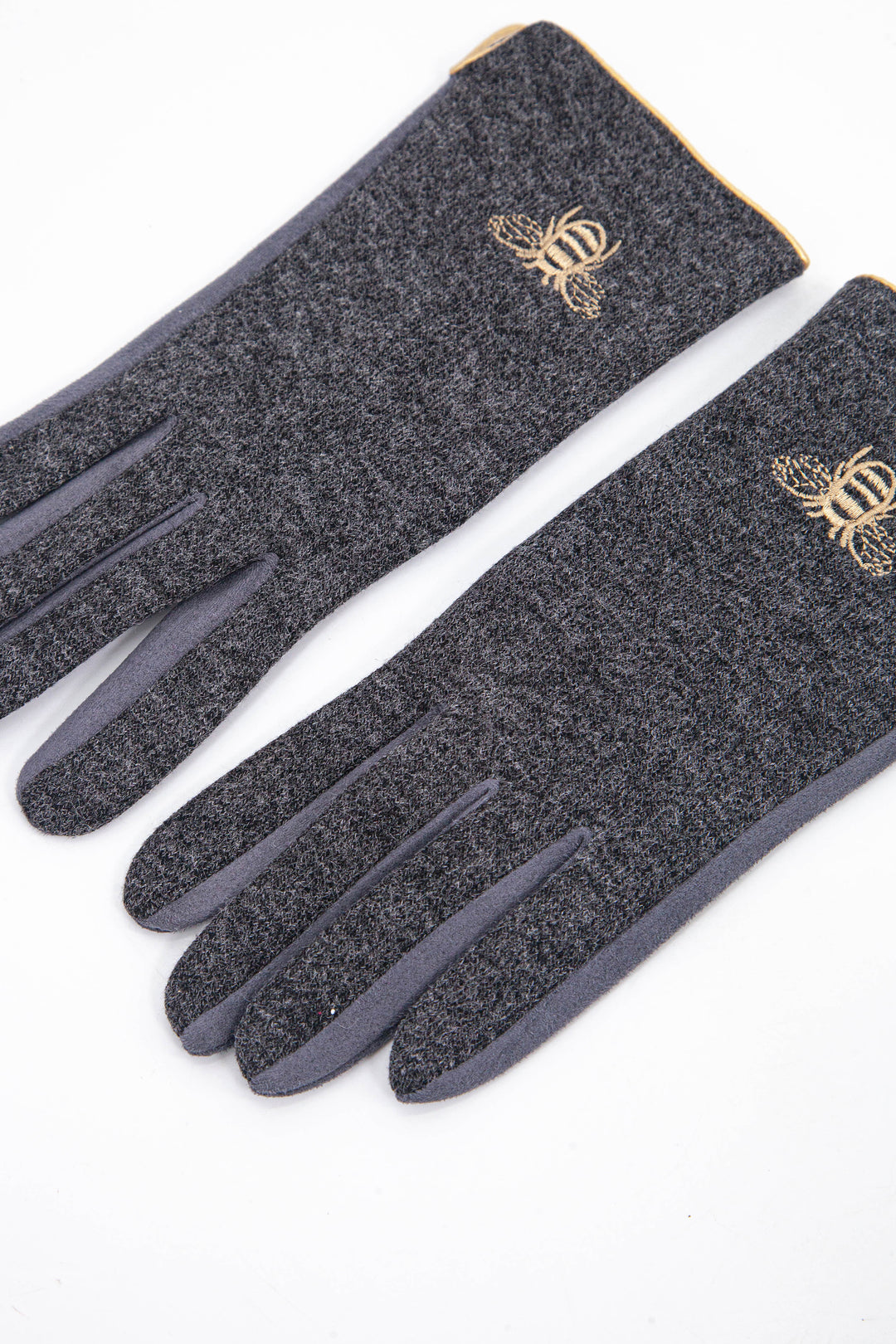 dark grey winter gloves with a gold embroidered bee motif on the back of the wrist.