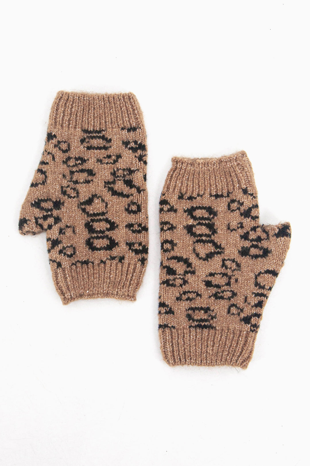 showing the neutral leopard print wrist warmers from above, showing the all over leopard print pattern and ribbed cuffs.