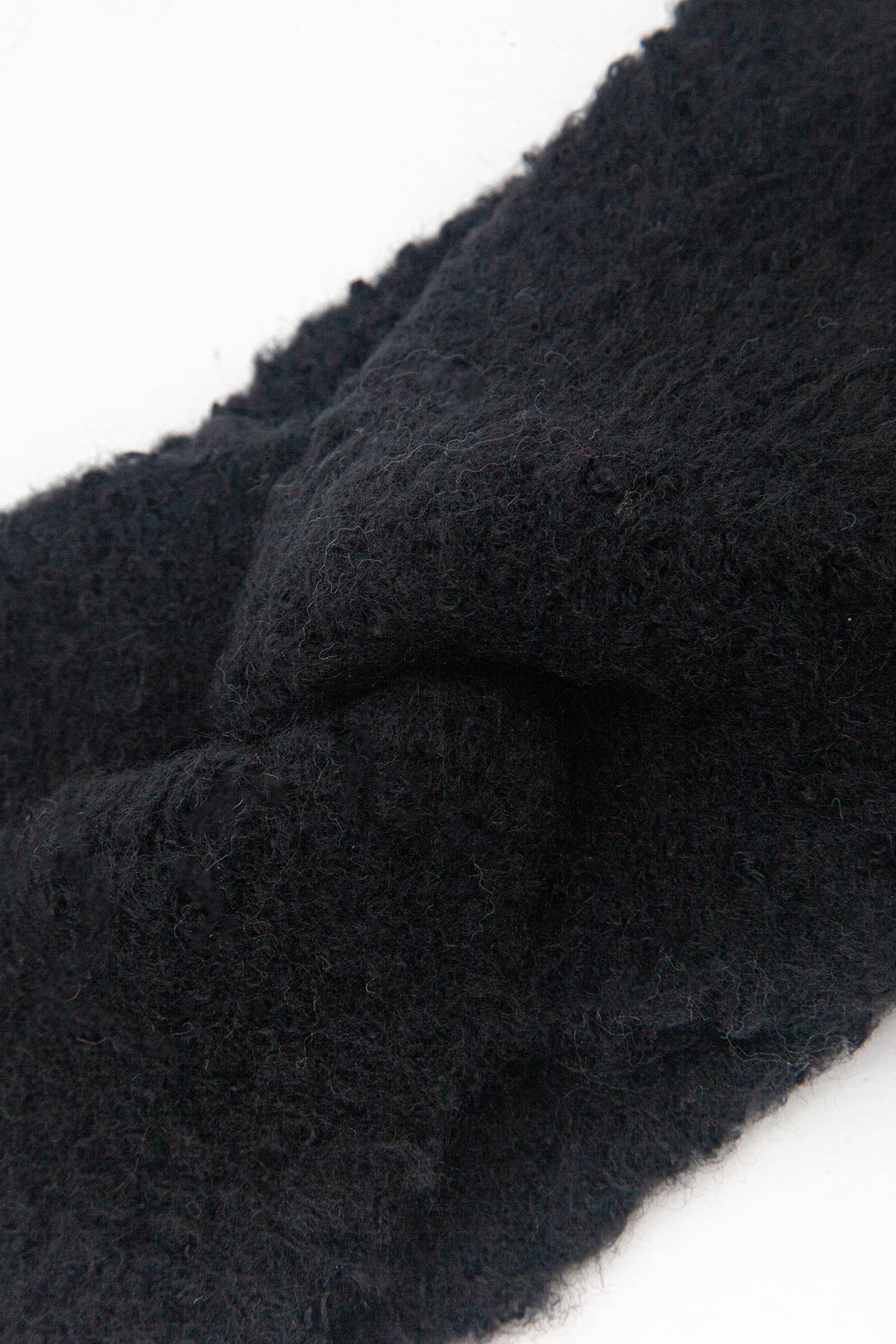 close up of the twist front on the knitted headband