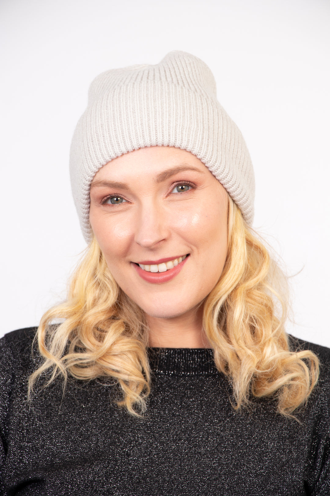 model wearing a ribbed light grey knitted beanie hat with an all over silver glitter sparkle