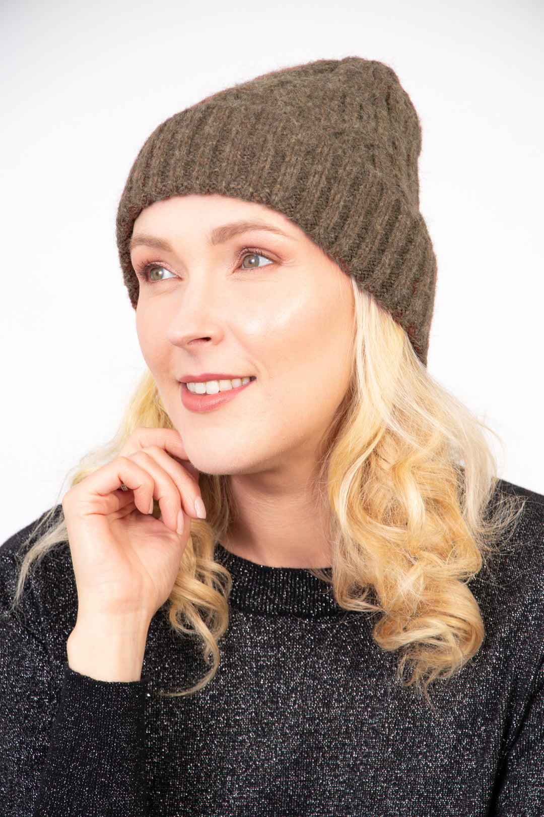 model wearing a khaki cable knit winter beanie hat